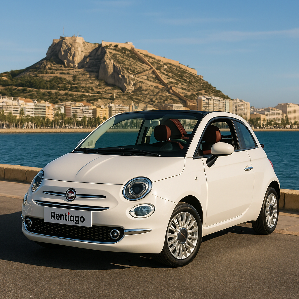 Fiat 500 rental car by Rentiago parked on Benidorm’s seafront with coastal skyline and castle hill in the background.
