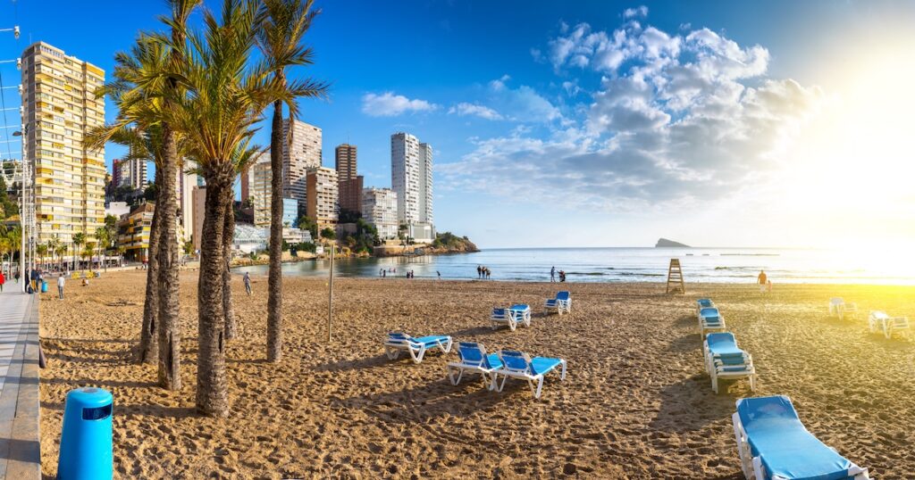 Рanoramic seascape view of summer resort with beach(Playa de Llevant) and famous skyscrapers. Costa Blanca. City of Benidorm, Alicante, Valencia, Spain.